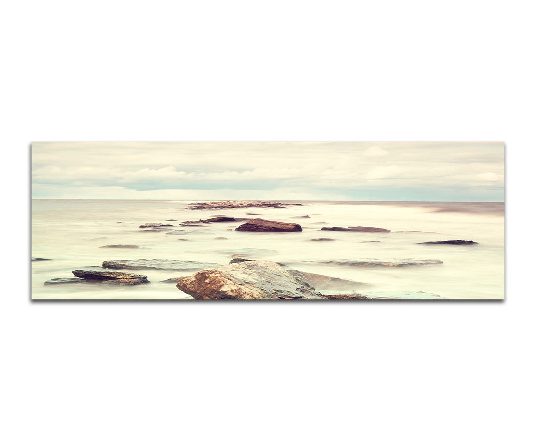 Paul Sinus Art Panoramabild auf Leinwand und Keilrahmen 150x50cm Meer Steine Nebel Wolken