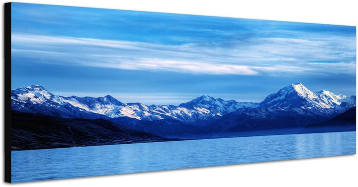 Paul Sinus Art Panoramabild auf Leinwand und Keilrahmen 150x50cm Berge Schnee Wasser Wolkenschleier