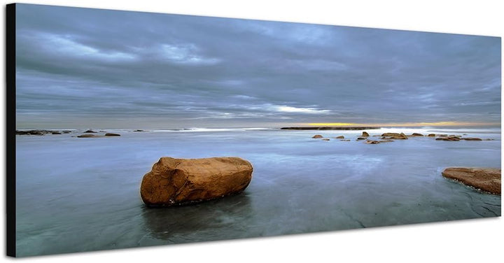 Paul Sinus Art Panoramabild auf Leinwand und Keilrahmen 150x50cm Meer Steine Wolken Dämmerung