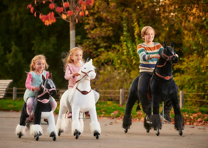 Ponnie Einhorn auf Rollen Merlin - Unicorn M mit rosa Sattel