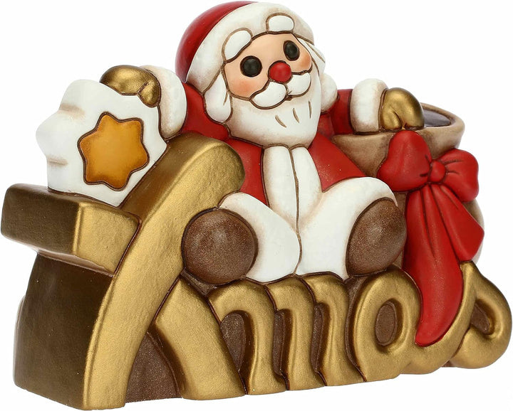 THUN - Weihnachten 2022 - Weihnachtsmann auf Xmas Schriftzug aus handverzierter Keramik - Weihnachts