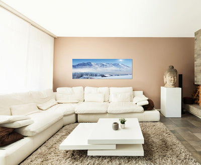 Paul Sinus Art Panoramabild auf Leinwand und Keilrahmen 150x50cm Winterlandschaft Berge Wald Häuser