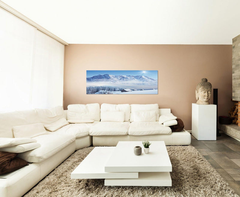 Paul Sinus Art Panoramabild auf Leinwand und Keilrahmen 150x50cm Winterlandschaft Berge Wald Häuser