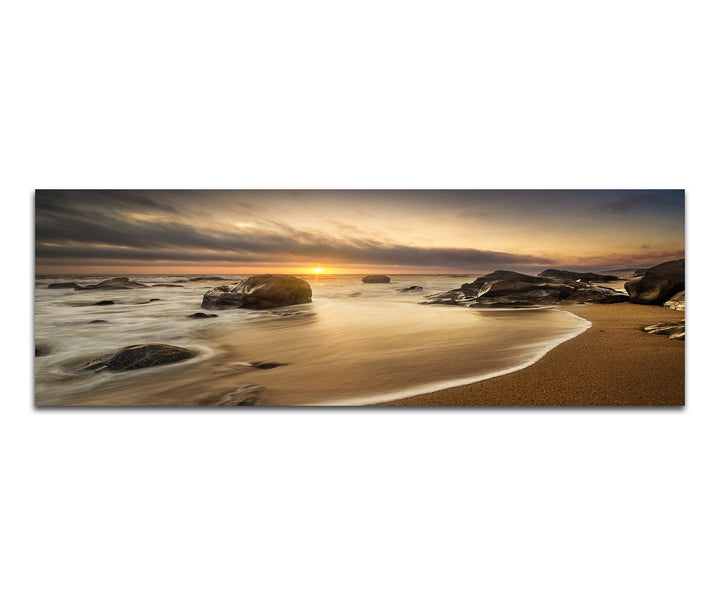 Paul Sinus Art Panoramabild auf Leinwand und Keilrahmen 150x50cm Meer Strand Steine Sonnenaufgang Wo