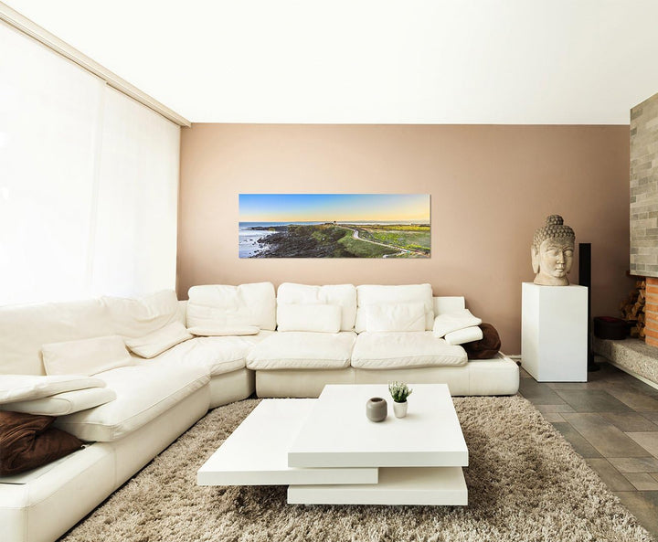 Paul Sinus Art Panoramabild auf Leinwand und Keilrahmen 150x50cm Meer Küste Strasse Wiese Kirche