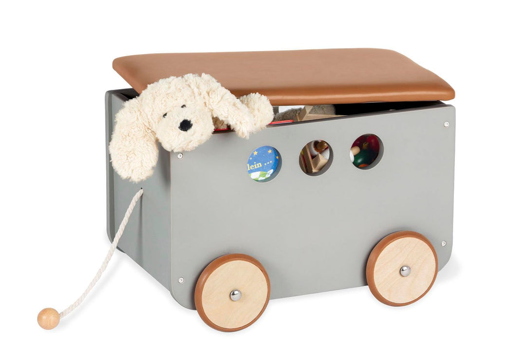 PINOLINO Spielzeugkiste Jim, aus Holz und Kunstleder, mit Zugschnur, gummierten Holzrädern und abneh