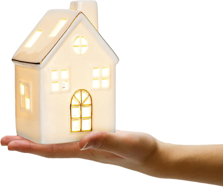 com-four® LED-Haus aus Porzellan - batteriebetriebenes Leuchthaus - weisses glänzendes Deko-Lichthäu