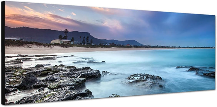 Paul Sinus Art Panoramabild auf Leinwand und Keilrahmen 150x50cm Strand Felsen Morgendämmerung Nebel