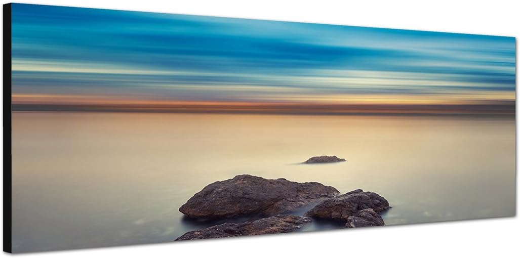 Paul Sinus Art Panoramabild auf Leinwand und Keilrahmen 150x50cm Meer Felsen Abendhimmel mystisch