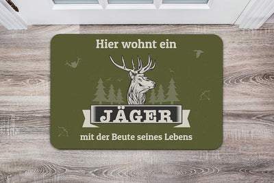 Tassenbrennerei Fussmatte mit Spruch Hier wohnt EIN Jäger mit der Beute seines Lebens - Fussabtreter