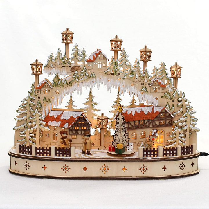 Dekohelden24 LED Holz Schwibbogen mit bewegtem Weihnachtsbaum, Motiv: Schneemann und Wanderfiguren,