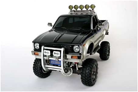 TAMIYA TMYTAM58397 1:10 RC Toyota HiLux HighLift 4x4 3-Gang - ferngesteuertes Auto - inkl. Surfbrett