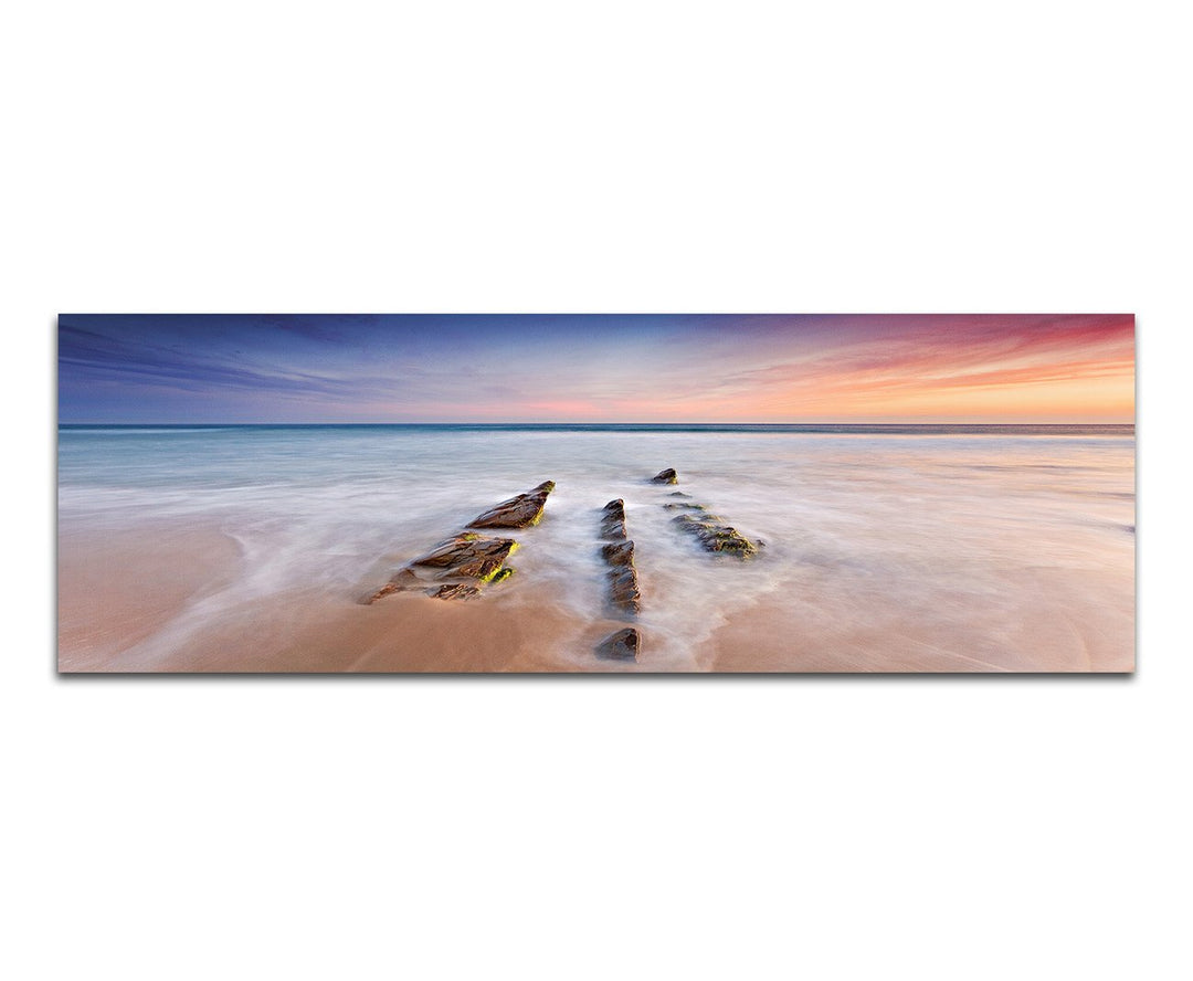 Paul Sinus Art Panoramabild auf Leinwand und Keilrahmen 120x40cm Strand Ozean Steine Horizont Abendr
