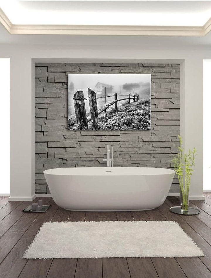 Pixxprint Monocrome, Rustikaler Holzzaun auf Wiese, Format: 100x70 auf Leinwand, 100x70