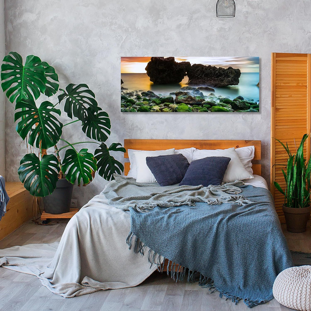 wandmotiv24 Leinwandbild Strand bei Sonnenuntergang mit Felsen 100x40cm (BxH) Bilder auf Leinwand, D
