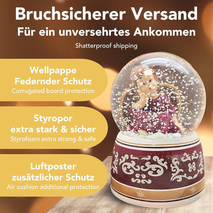 Schneekugel Weihnachten mit Musik | Engel rot verträumt Gold | Sockel rot Gold Ornamente | H: 14cm B