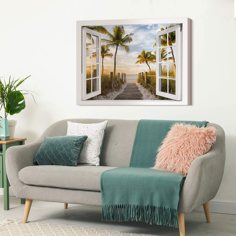 PICANOVA – Bild auf Leinwand Palmenweg zum Meer Fenster 80x60cm – Leinwandbild – Premium Leinwanddru