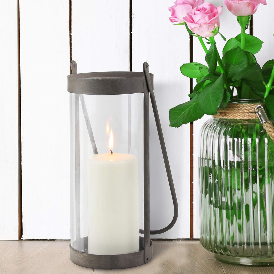 Stonebriar Industrial Glass Cylinder Hurricane Candle Lantern with Rustic Zinc Metal Frame and Handl