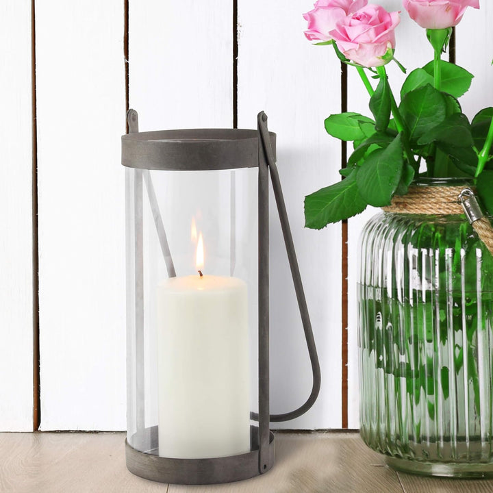 Stonebriar Industrial Glass Cylinder Hurricane Candle Lantern with Rustic Zinc Metal Frame and Handl