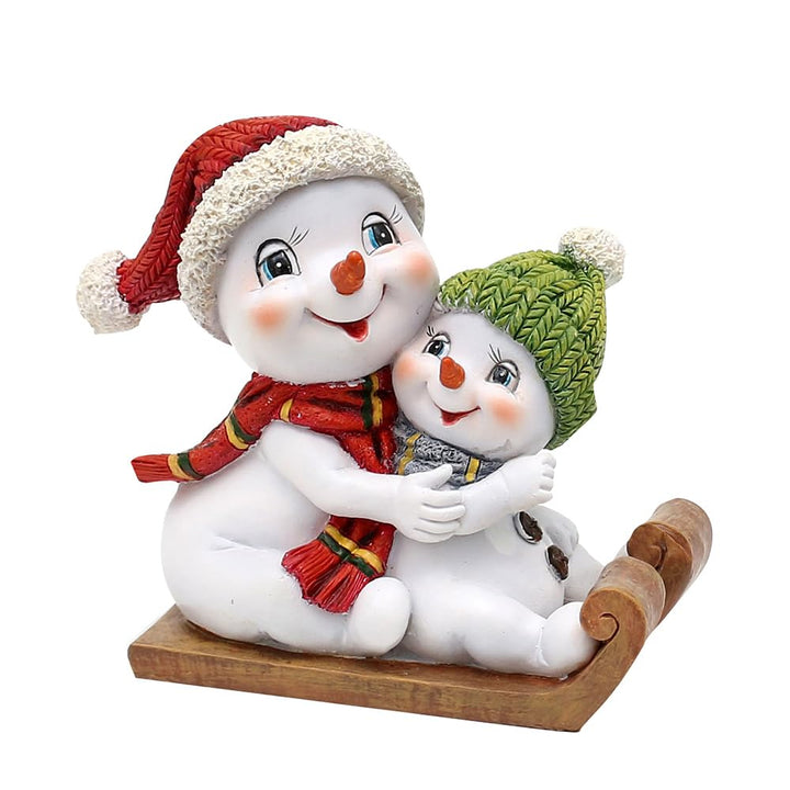 Dekohelden24 Schneekinderpaar - Schneemänner mit Mütze und Schal in rot-grün auf Schlitten, L/B/H 14