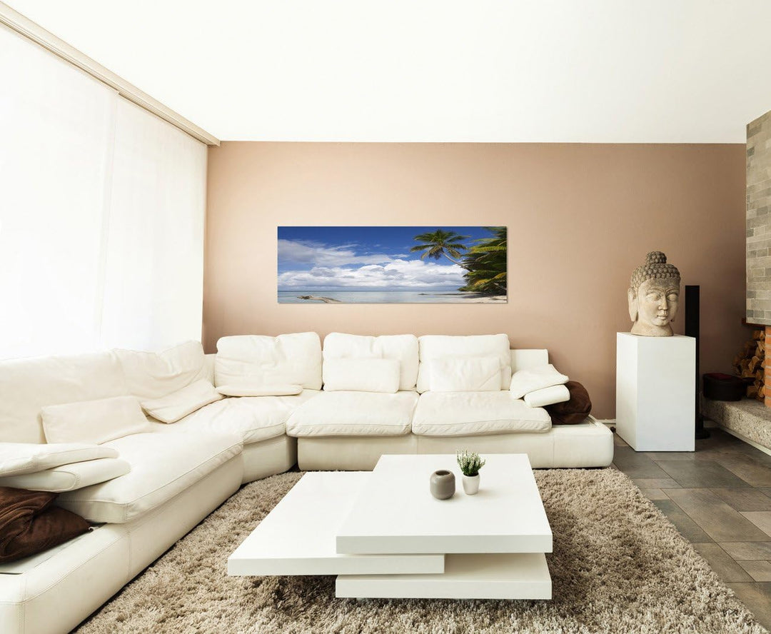 Paul Sinus Art Panoramabild auf Leinwand und Keilrahmen 150x50cm Strand Meer Wolken Palmen Holzstamm