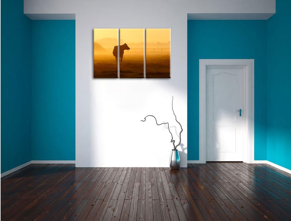 Pixxprint eine fressende Kuh auf der Weide als Leinwandbild - Grösse: 3-Teilig (120x80cm) - Wandbild