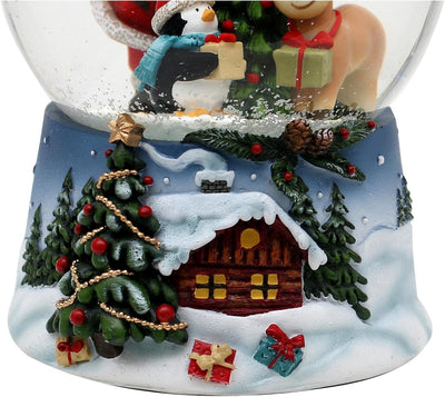 Dekohelden24 Schneekugel Santa mit Rentier und Pinguin blauem Sockel mit Weihnachtliche Winterlandsc