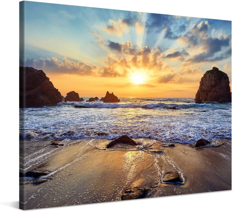 PICANOVA – Bild auf Leinwand Felsiger Strand Sonnenuntergang 100x75cm – Leinwandbild – Premium Leinw