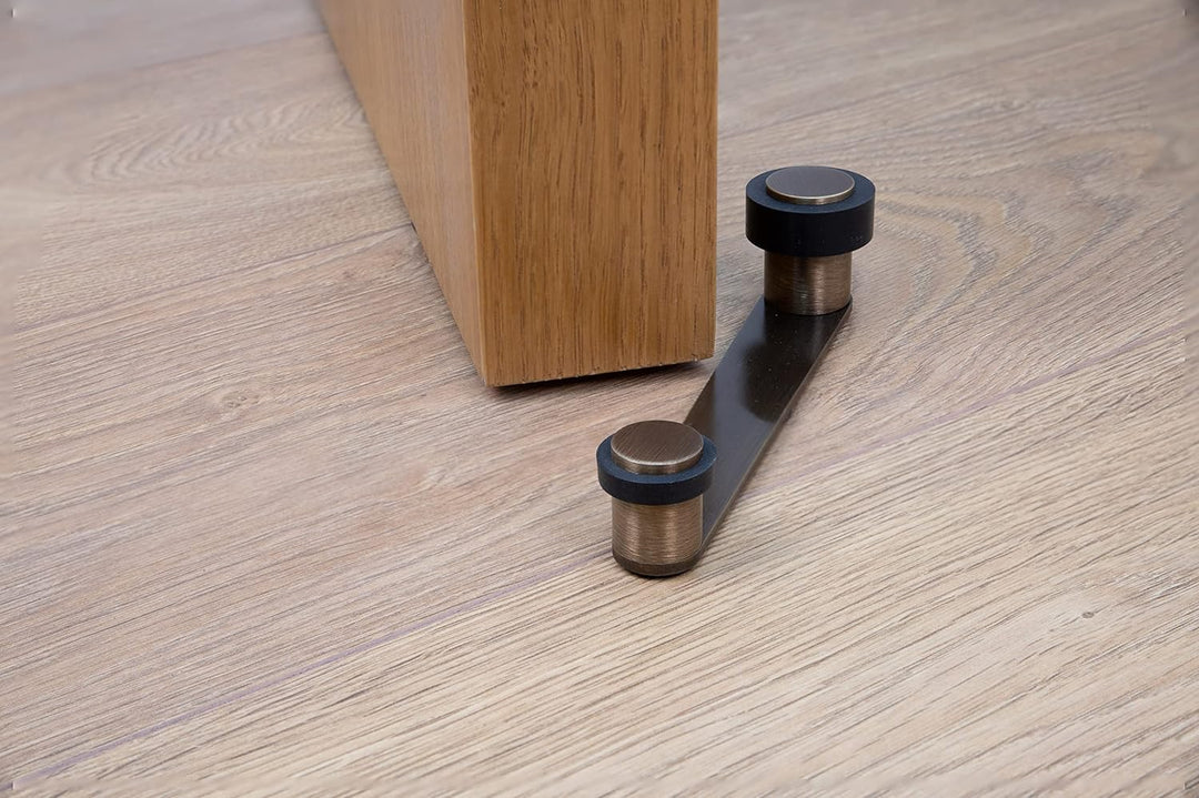 Türstopper mit drehbarem Halter | für Türstärke bis 100 mm | Messing | inkl. Schraube + Dübel | Ref.