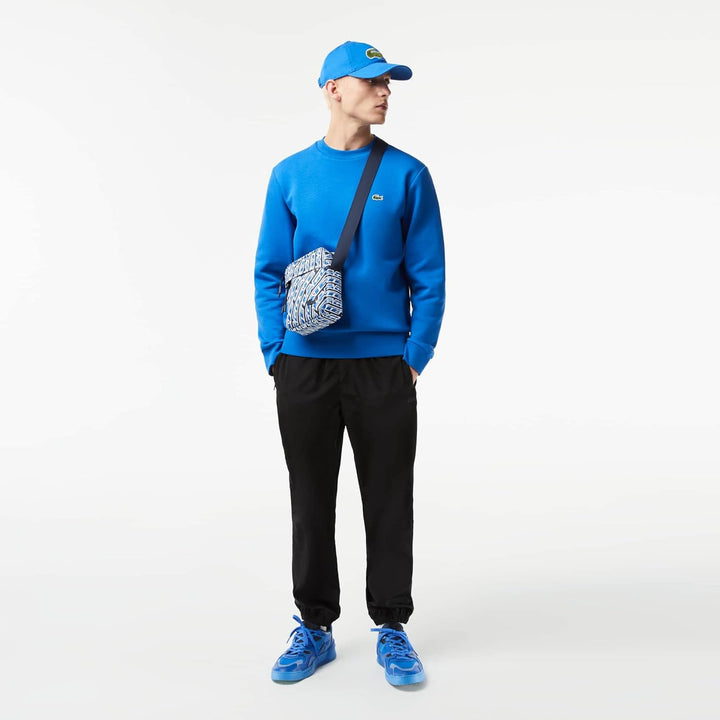 Lacoste Herren Umhängetasche VERTICAL CAMERA BAG,100% recyceltes Polyester Mono Grossbritannien, Wei