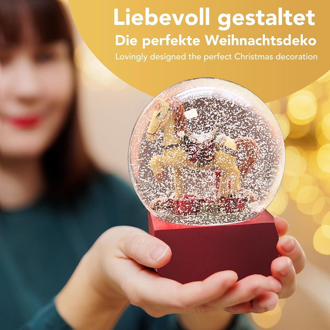 Weihnachts-Schneekugel | Schaukelpferd mit Geschenken | Farbe rot Gold | 100mm breit, 120mm hoch | B