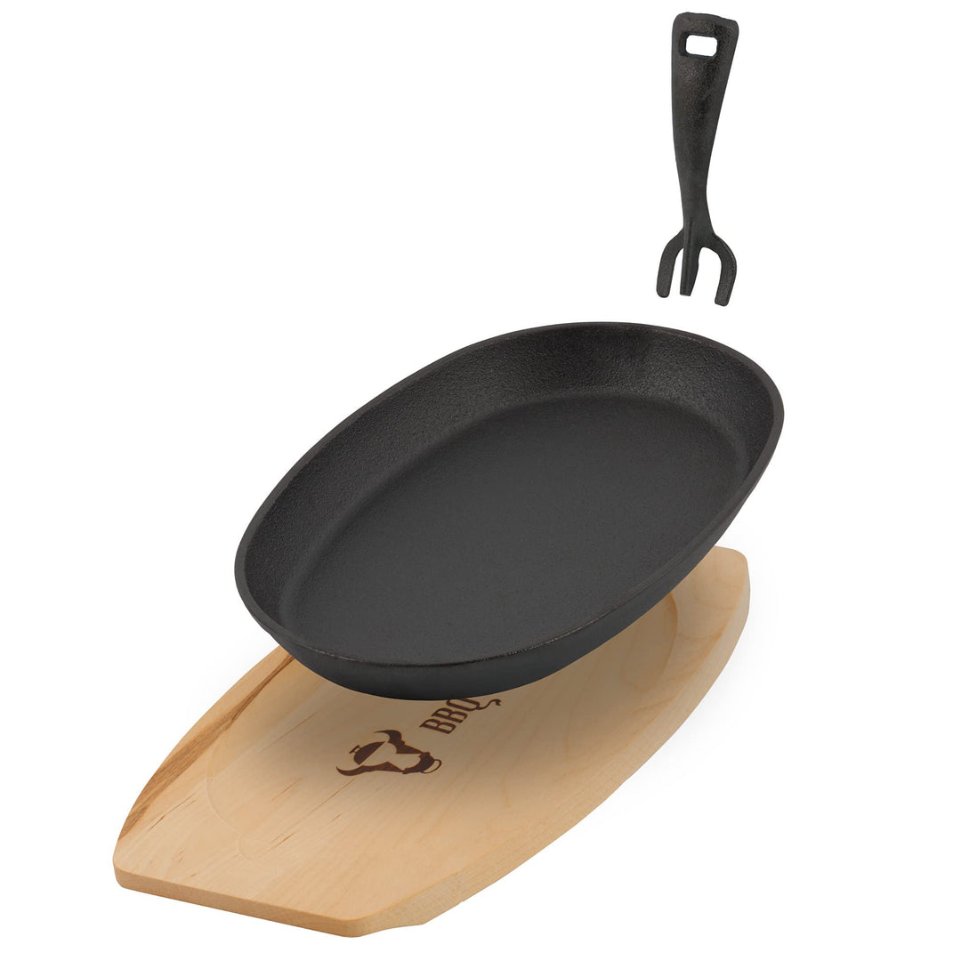 BBQ-Toro Gusseisen Servierpfännchen mit Holzunterlage (1 Stück) | 27 x 18 x 3 cm - oval | bereits ei