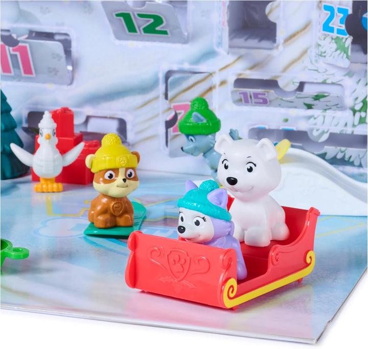PAW PATROL Adventskalender 2026, ab 3 Jahren | 24 Türchen | 7 Hundefiguren | 6 Schlitten | Verpackun