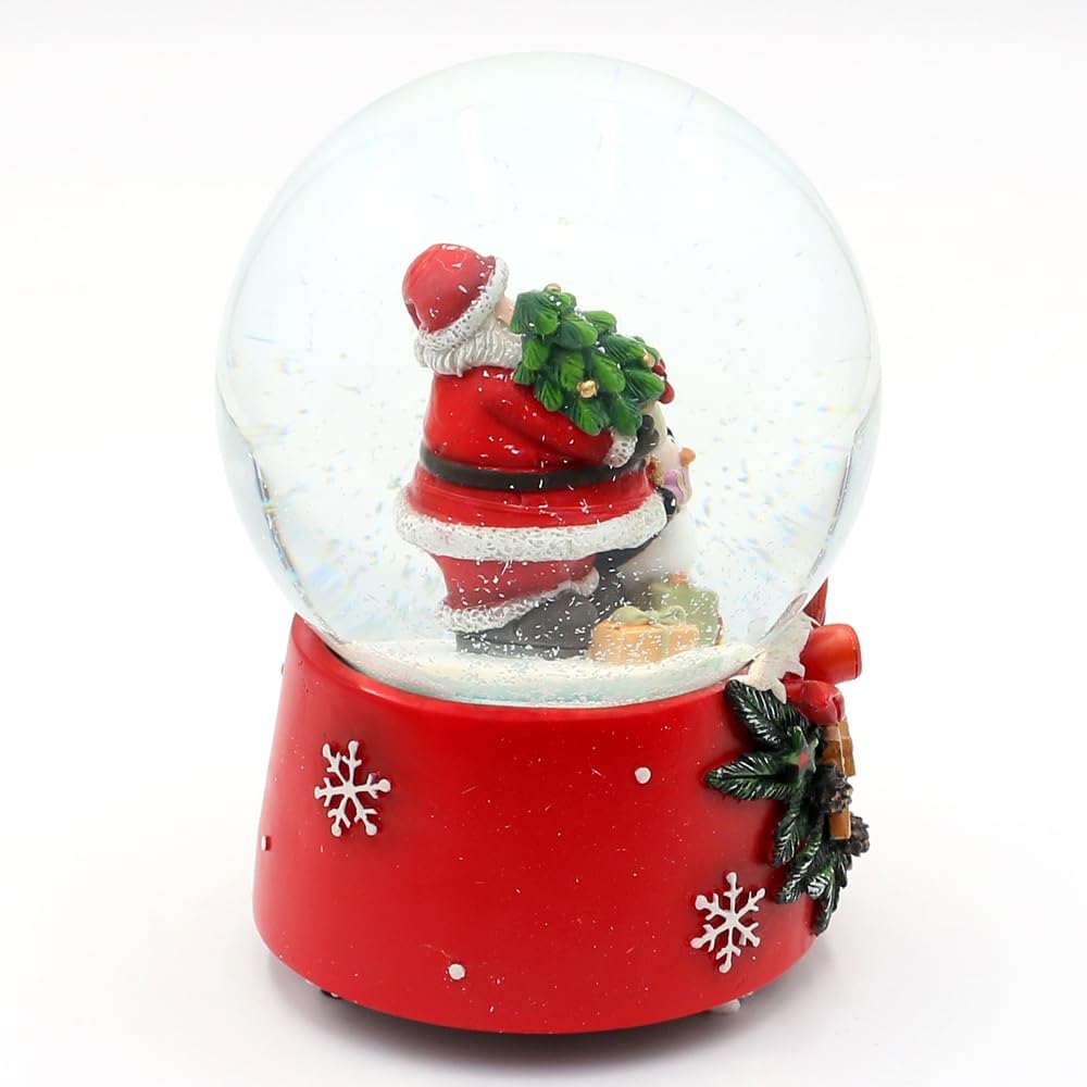 Schneekugel Santa mit Pinguin auf weihnachtlichen Sockel mit Spielwerk, Melodie Feliz Navidad, L/B/H
