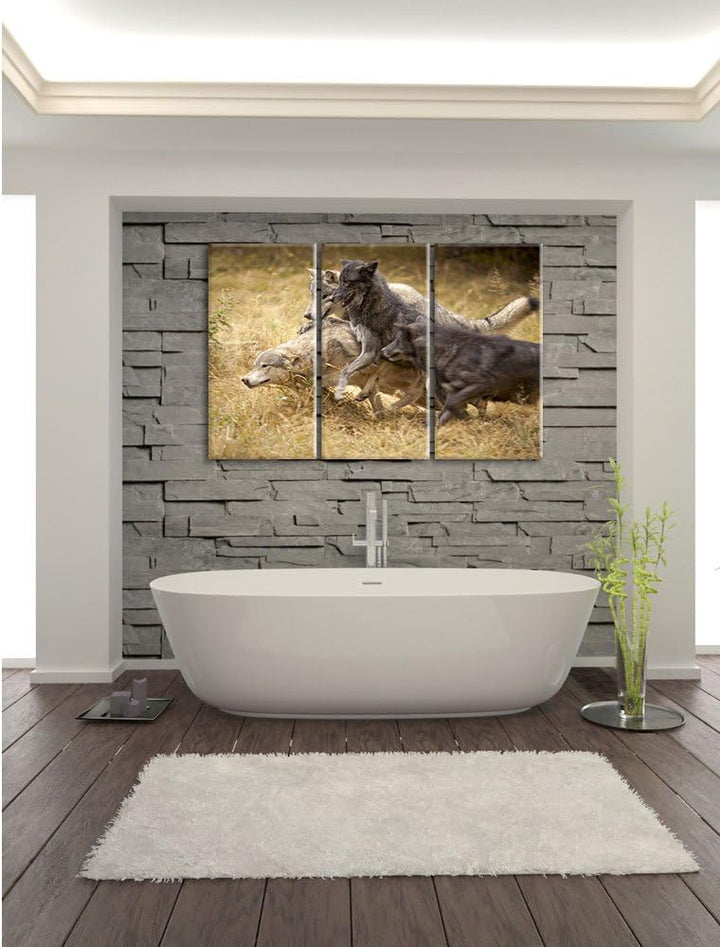 Pixxprint Tobendes Wolfsrudel als Leinwandbild | Grösse: 3 Teilig (120x80) | Wandbild| Kunstdruck |