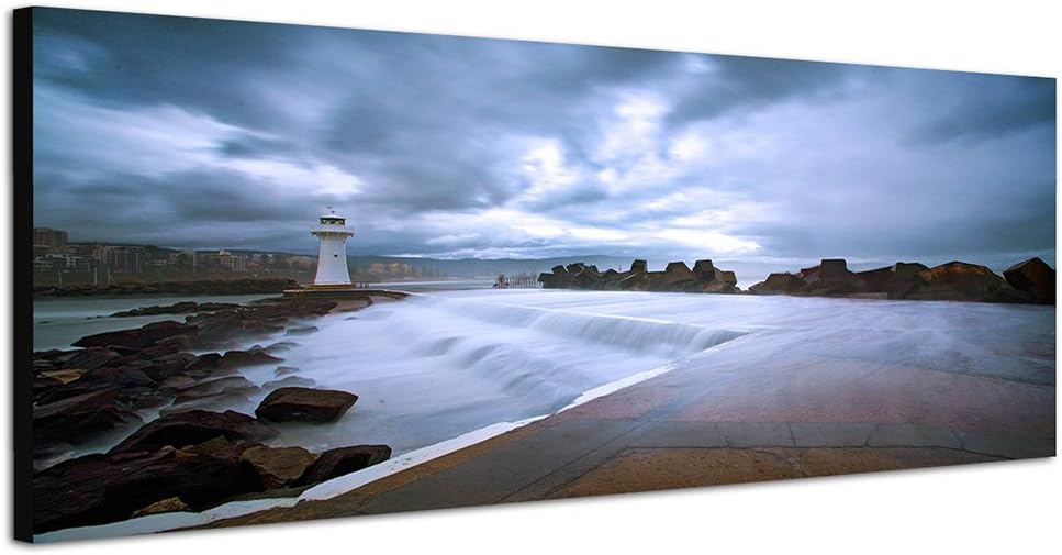 Paul Sinus Art Panoramabild auf Leinwand und Keilrahmen 150x50cm Küste Felsen Meer Leuchtturm Wolken