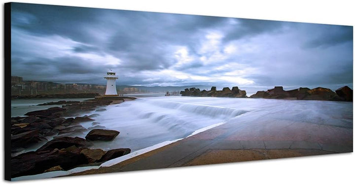 Paul Sinus Art Panoramabild auf Leinwand und Keilrahmen 150x50cm Küste Felsen Meer Leuchtturm Wolken