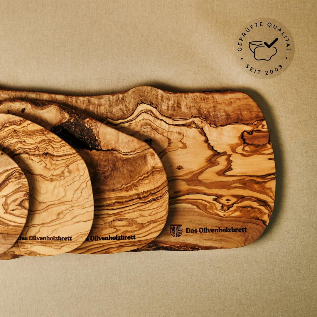 das Olivenholzbrett® Schneidebrett Olivenholz, Brotzeitbrett aus Holz mit naturbelassenem Rand, 25 c