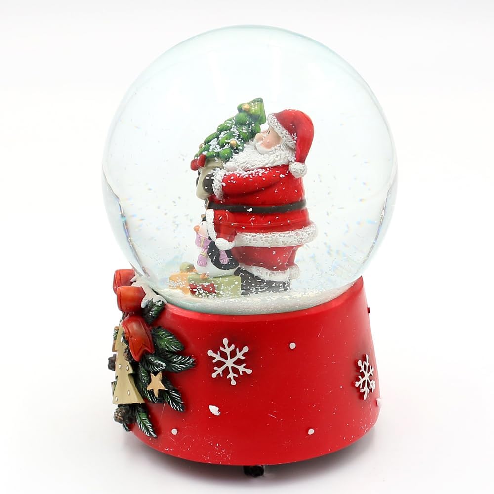 Schneekugel Santa mit Pinguin auf weihnachtlichen Sockel mit Spielwerk, Melodie Feliz Navidad, L/B/H