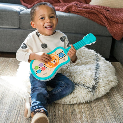 Baby Einstein 12609 Hape Sing & Strum Magic Touch Ukulele, Musikspielzeug aus Holz, mit 6 Melodien u