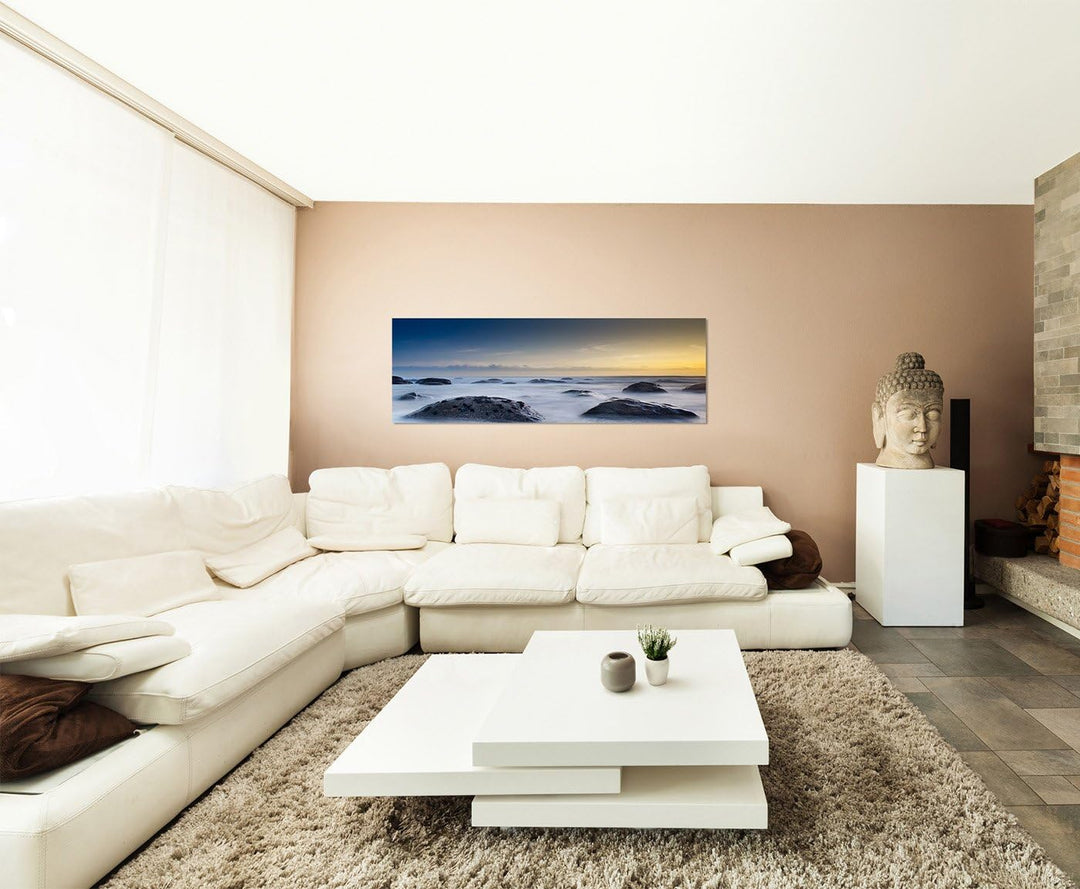 Paul Sinus Art Panoramabild auf Leinwand und Keilrahmen 150x50cm Meer Strand Steine Nebel Abenddämme