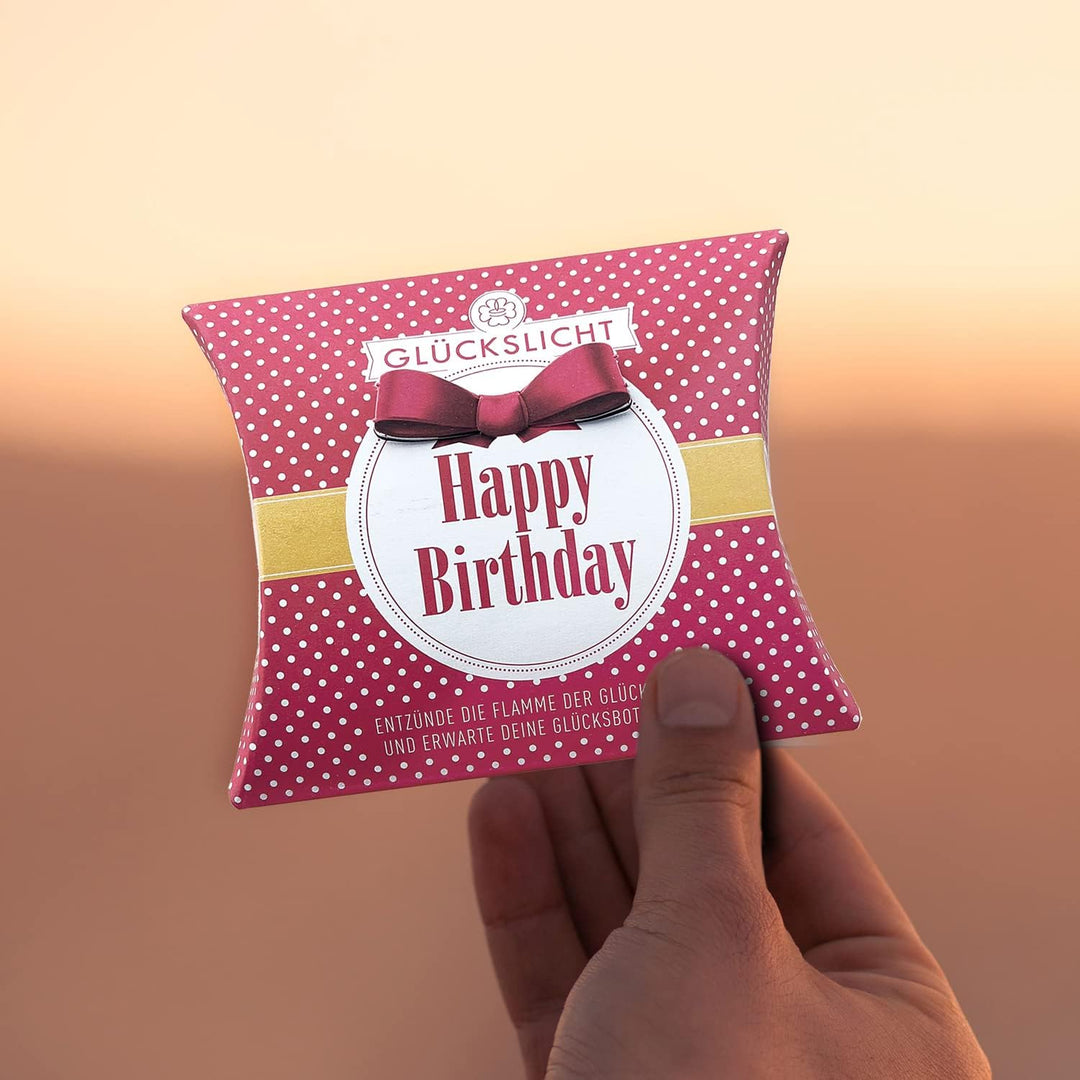 Glückslicht/Dots/Happy Birthday/Fröhlich rote Geschenkbox mit weissen Punkten und oranger Banderole