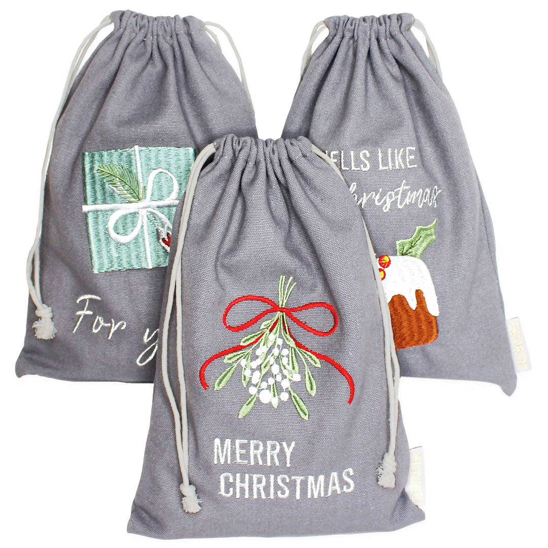 Papierdrachen Geschenkverpackung Weihnachten 2025 - Stoffbeutel 3er Set - 20x30 cm - grau - mit Stic