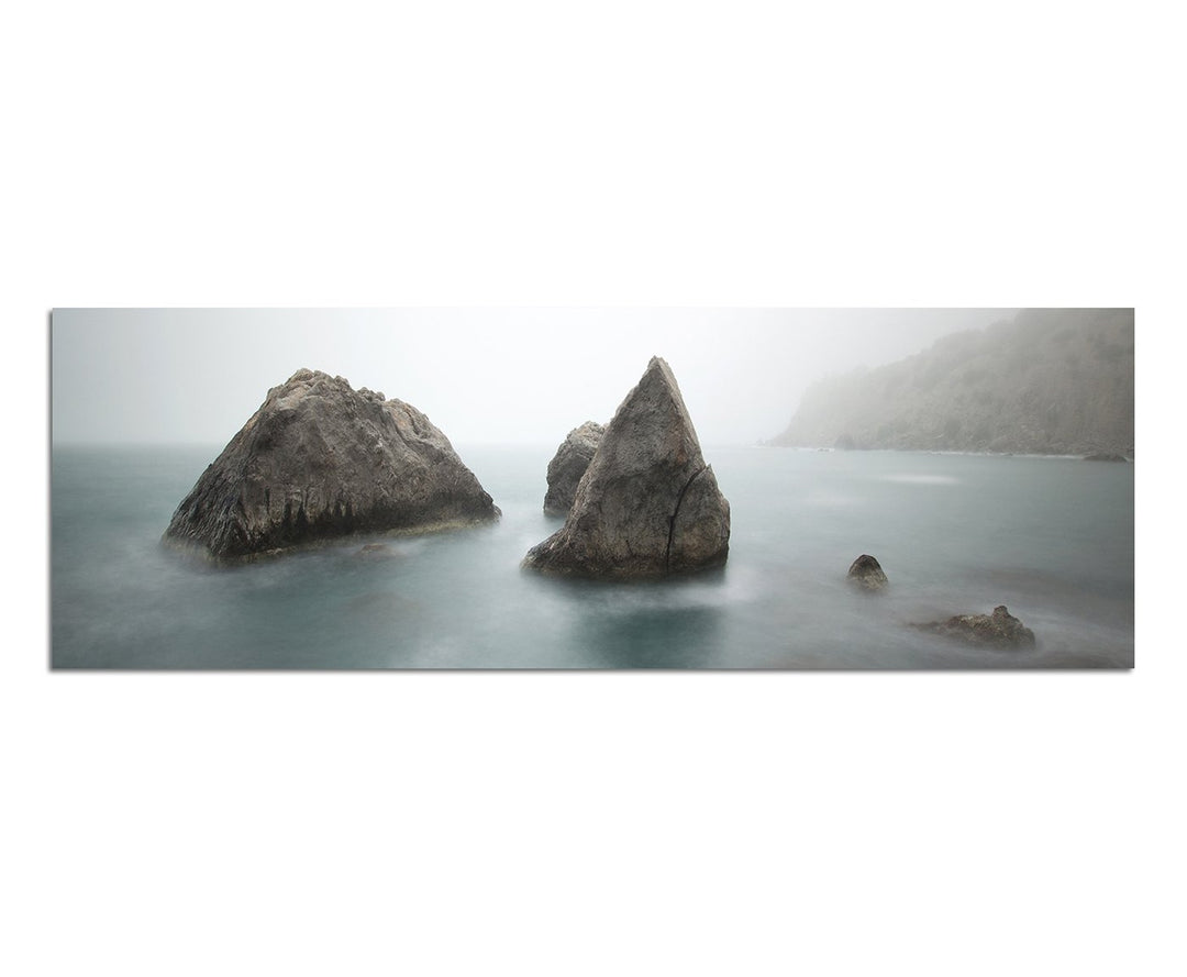 Paul Sinus Art Panoramabild auf Leinwand und Keilrahmen 150x50cm Meer Morgendämmerung Nebel Felsen