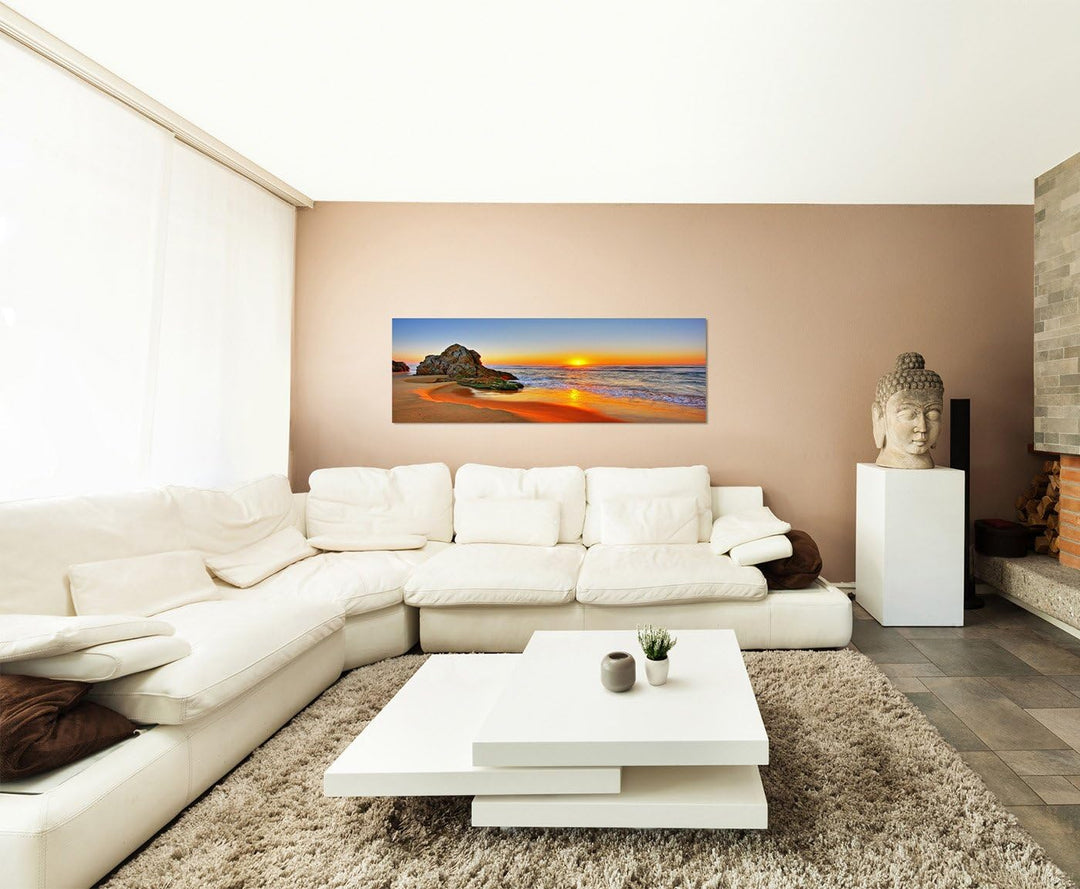 Paul Sinus Art Panoramabild auf Leinwand und Keilrahmen 150x50cm Strand Meer Sonnenaufgang Fels