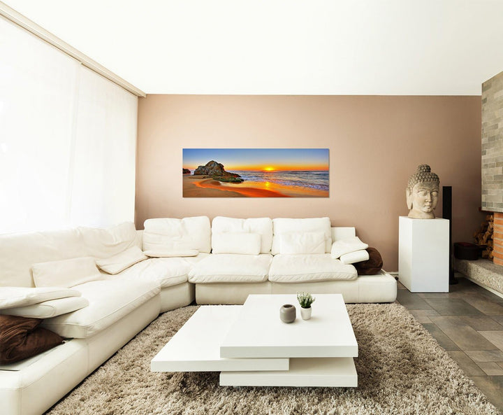Paul Sinus Art Panoramabild auf Leinwand und Keilrahmen 150x50cm Strand Meer Sonnenaufgang Fels
