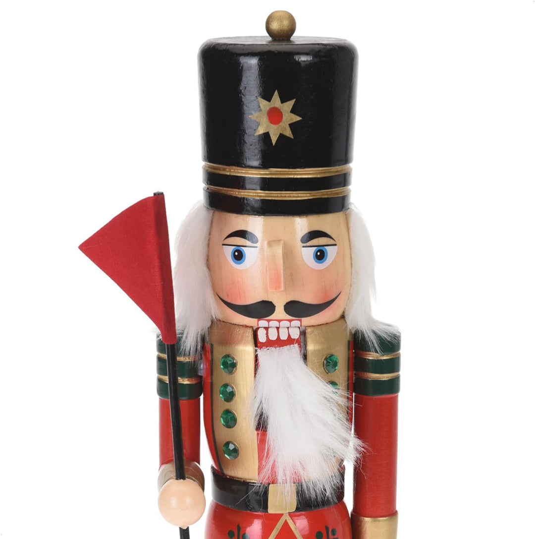 com-four® Dekofigur Nussknacker mit roter Fahne - Weihnachtsdeko in Form eines traditionellen Nusskn