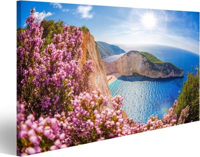 islandburner Bild Bilder auf Leinwand Navagio-Strand mit Schiffswrack und Blumen gegen Sonnenunterga