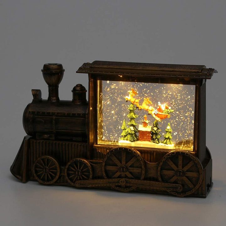 Dekohelden24 (99) LED Zug mit Weihnachtsmann, Glitterwirbel, und Sound. Adapter- und Batteriebetrieb