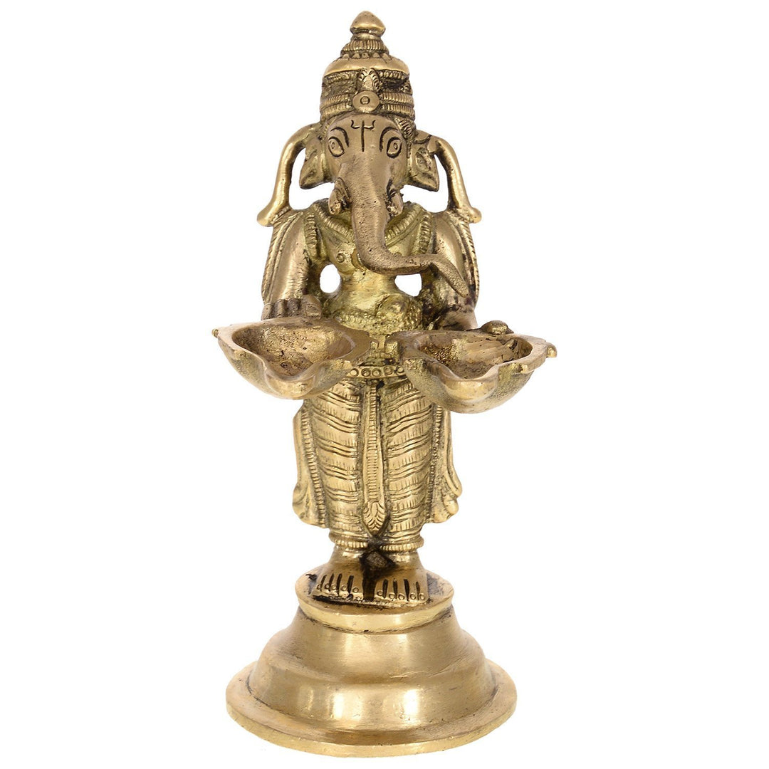 Purpledip Unique Brass Ganpati Idol holding twin diyas, Indian gift Ideas (10222)